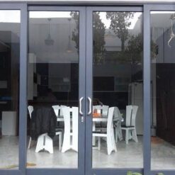 Cửa đi lùa lắp ghép nhôm Kalat kính dán 6.38mm